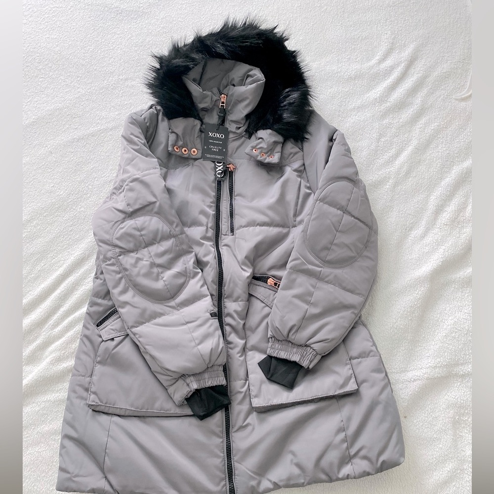 100% Vegan Fur/ Color: Grey/Steel/Has Multiple Pockets with Zippers/Cruelty Free